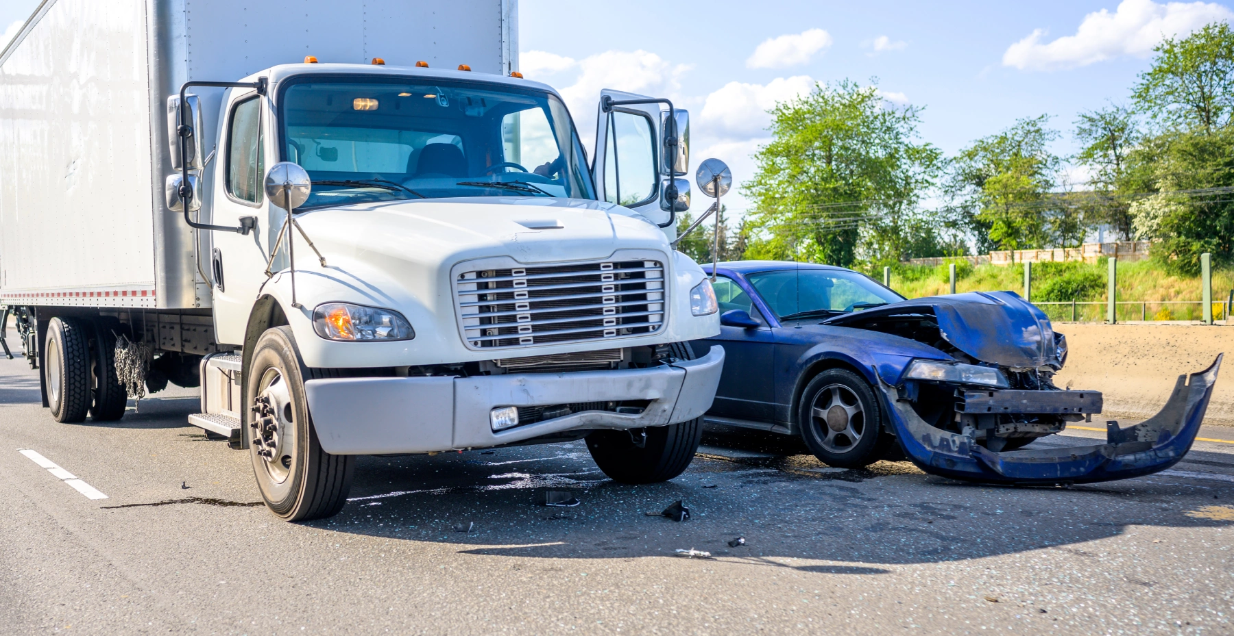 commercial vehicle accident with a blue sedan