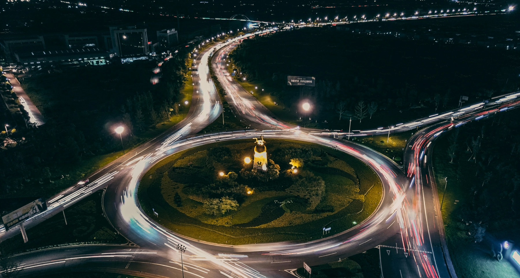 a busy round-a-bout at night